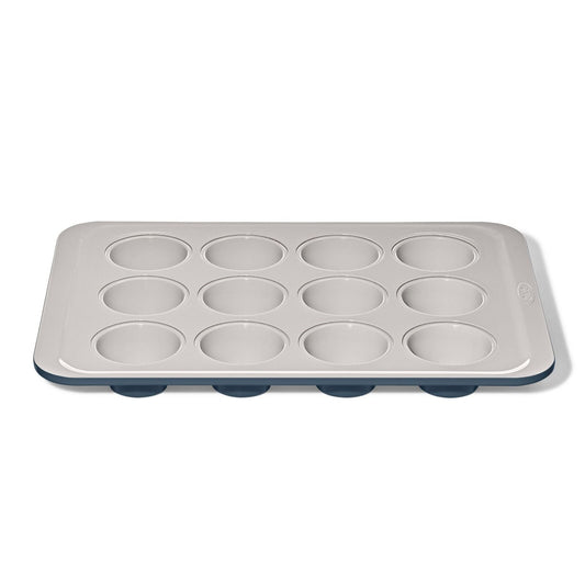 non-stick-pro-ceramic-coated-metal-bakeware-12-cup-muffin-pan-storm-blue-q5 oxo_12-cup-muffin-pan-stormblue_apdp_00_main.jpg